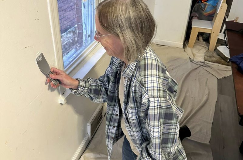 Hands-on help, repairing walls for a neighbor in need